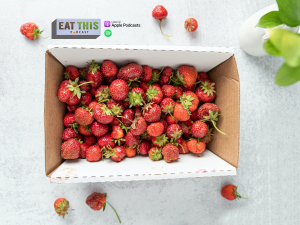 strawberries in a box with Eat This Podcast logo